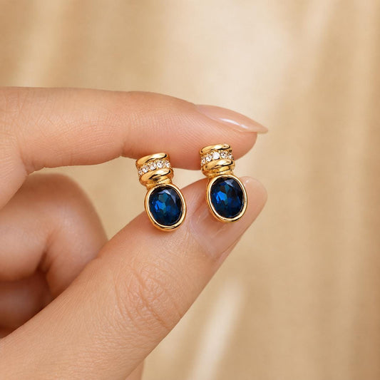 Blue glass gold oval stud earrings - close-up detail