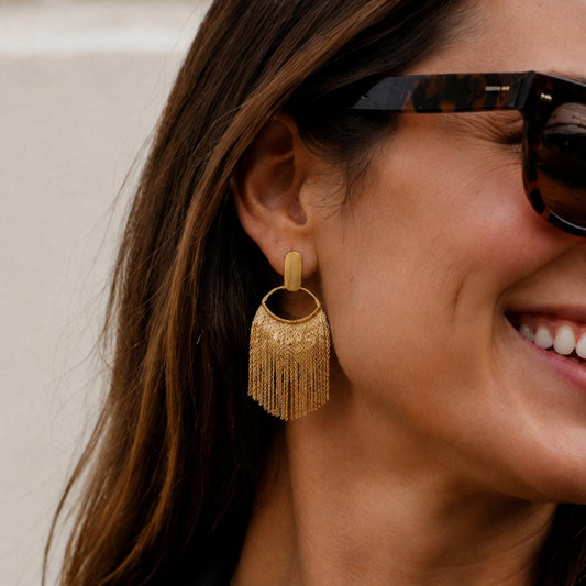 Gold chain fringe earrings - close-up detail