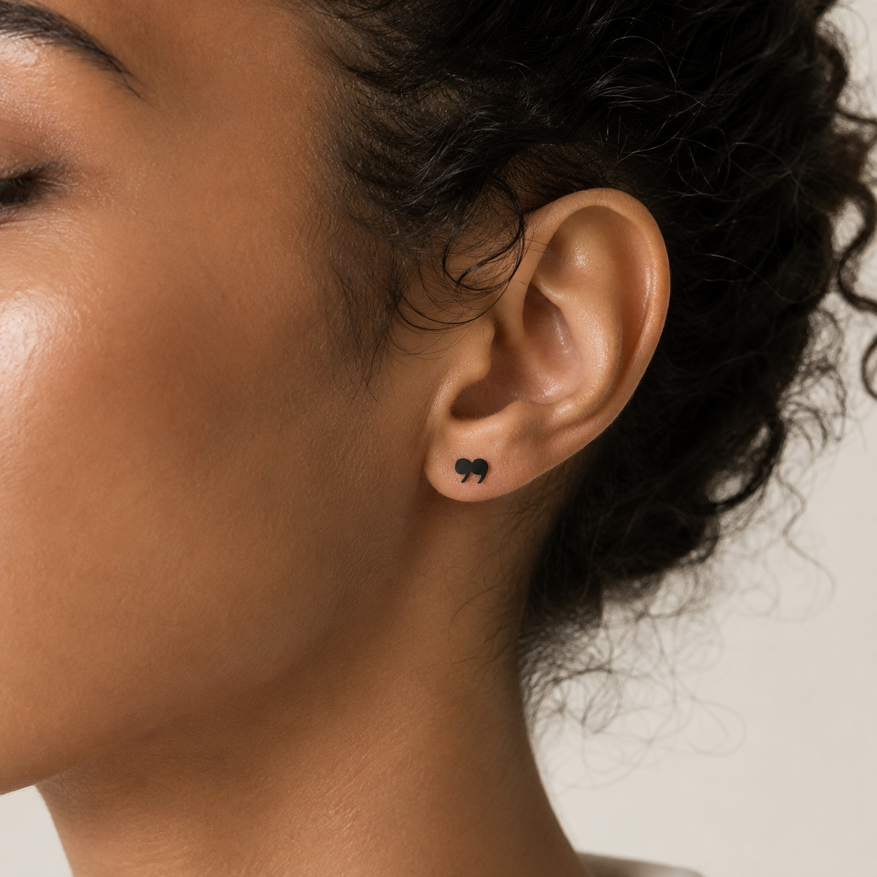 Petite matte-black quotation mark studs, minimalist literary jewelry close-up - EffortlesslyUs
