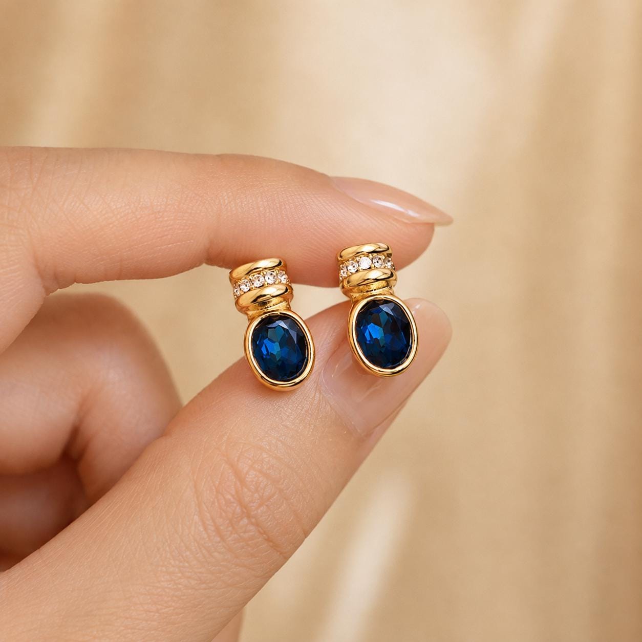 Blue glass gold oval stud earrings - close-up detail