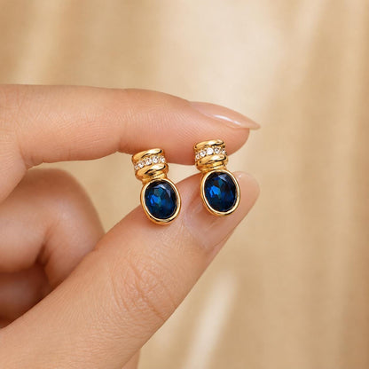Blue glass gold oval stud earrings - close-up detail