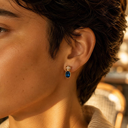 Blue glass gold oval stud earrings finish detail