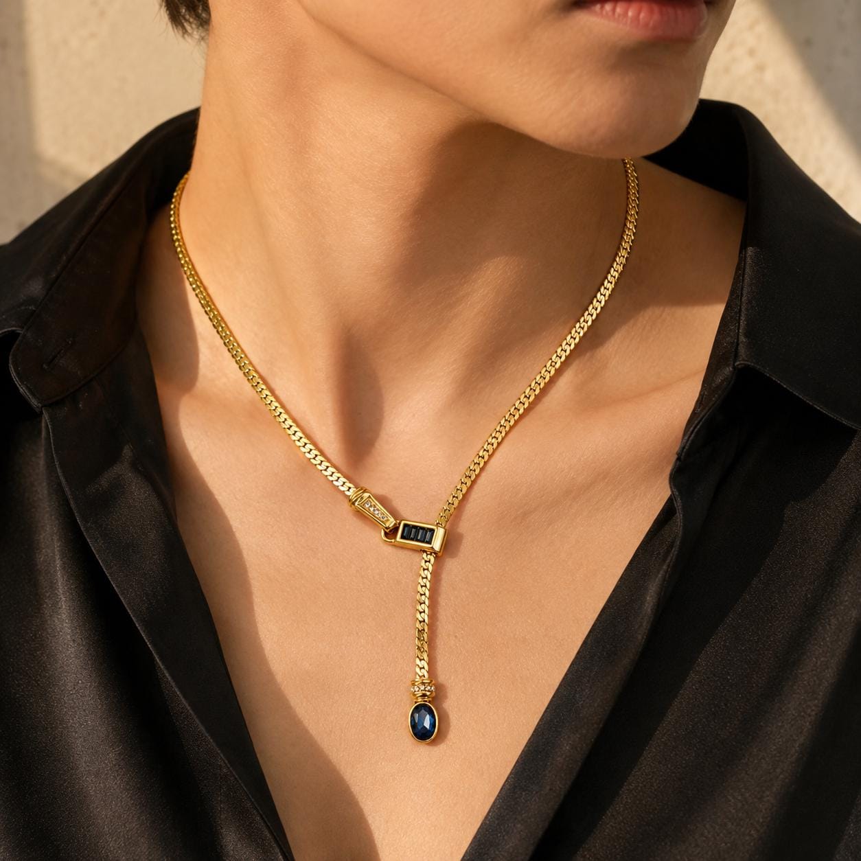 Gold Y lariat necklace blue glass pendant detail