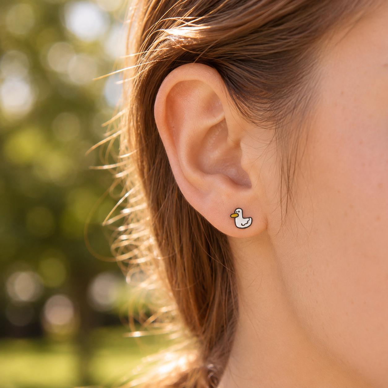 Duck stud earrings - close-up detail