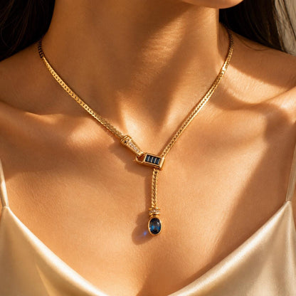 Gold Y lariat necklace with blue glass drop pendant