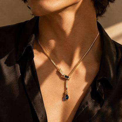 Gold Y lariat necklace worn on model