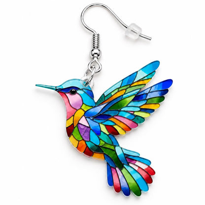 Colorful hummingbird earrings worn on model