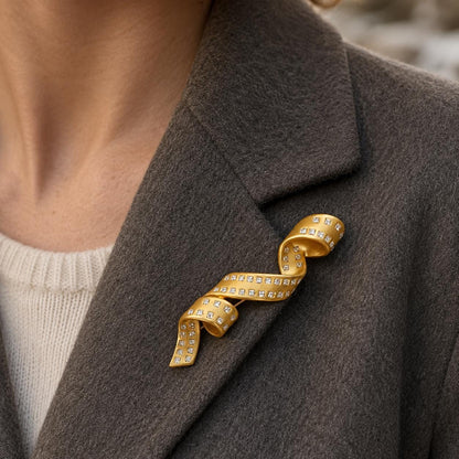 Gold spiral brooch crystal detail