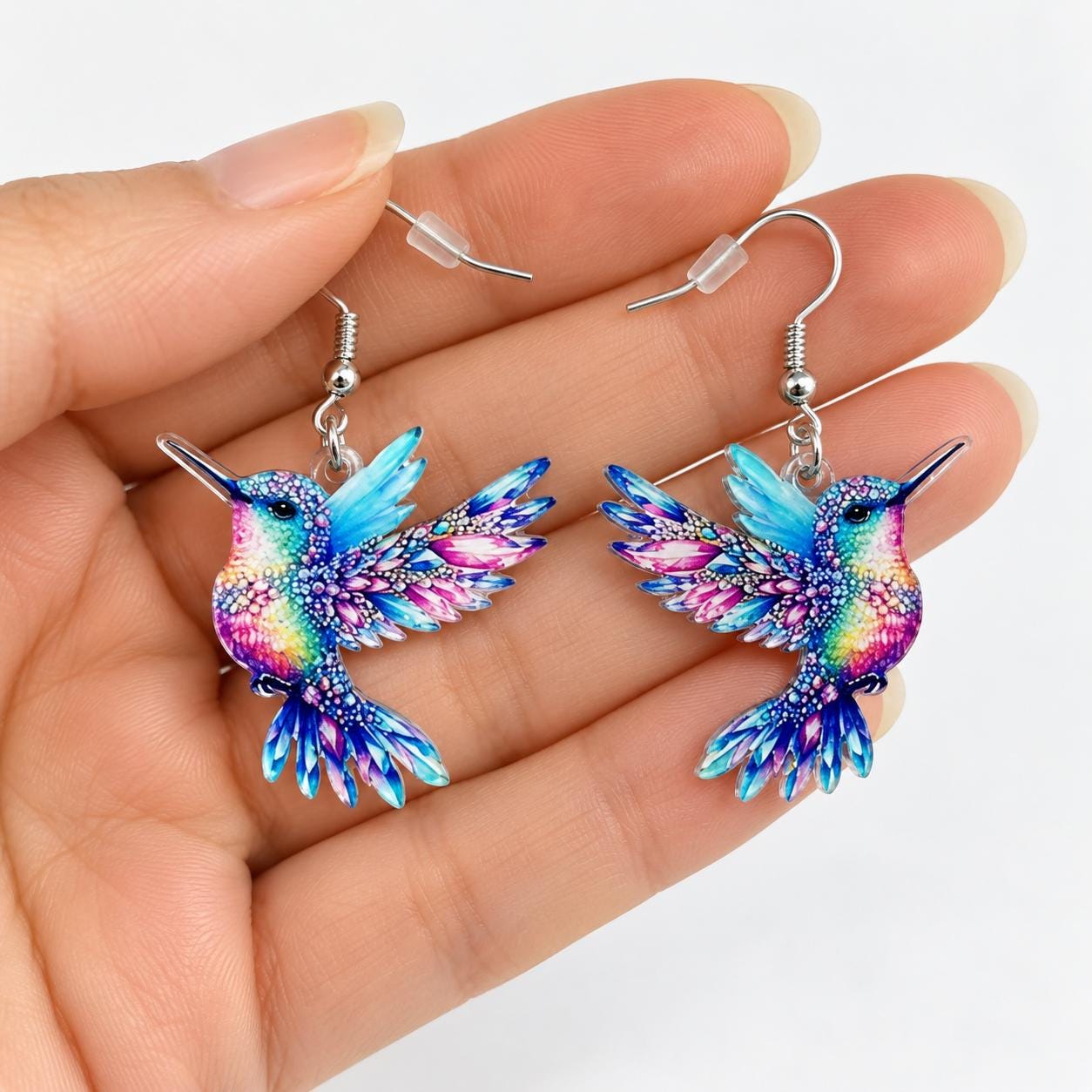 Rainbow hummingbird earrings worn on model