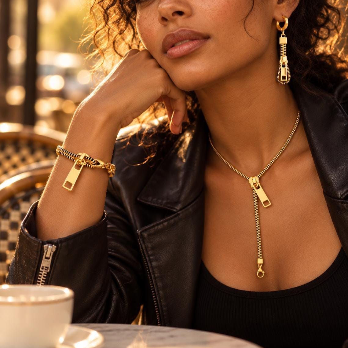 Zipper drop earrings worn on model