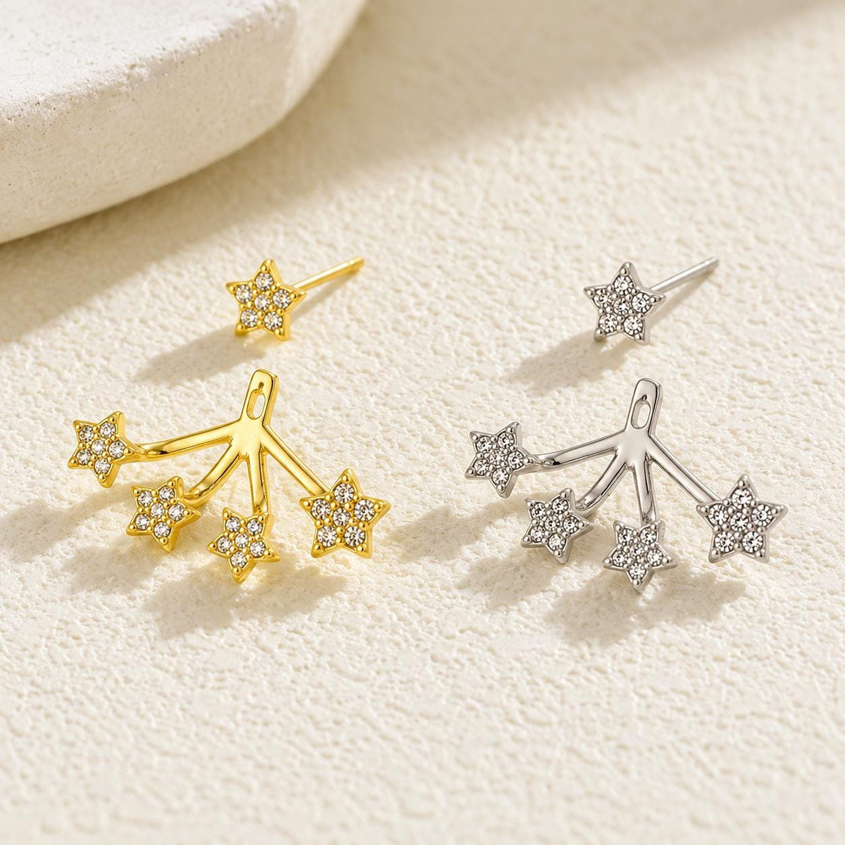 Star ear jackets on neutral background