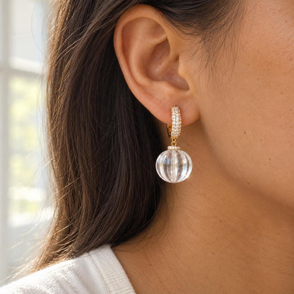 Clear glass bead earrings flat lay