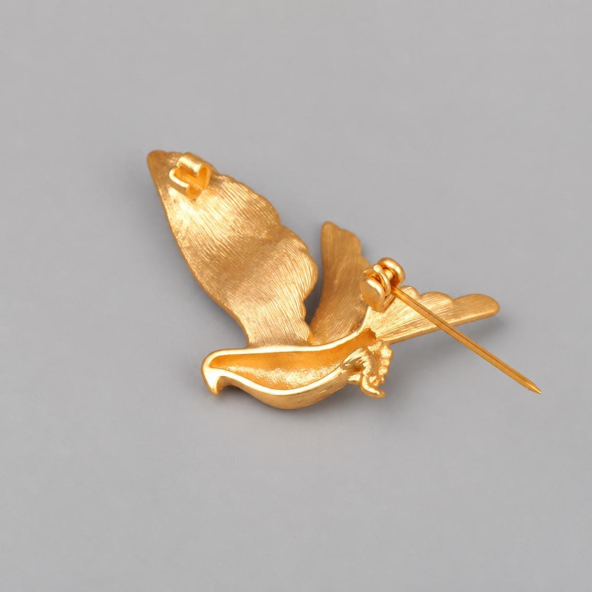 Brass dove brooch feather detail