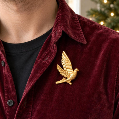 Brass dove brooch flat lay
